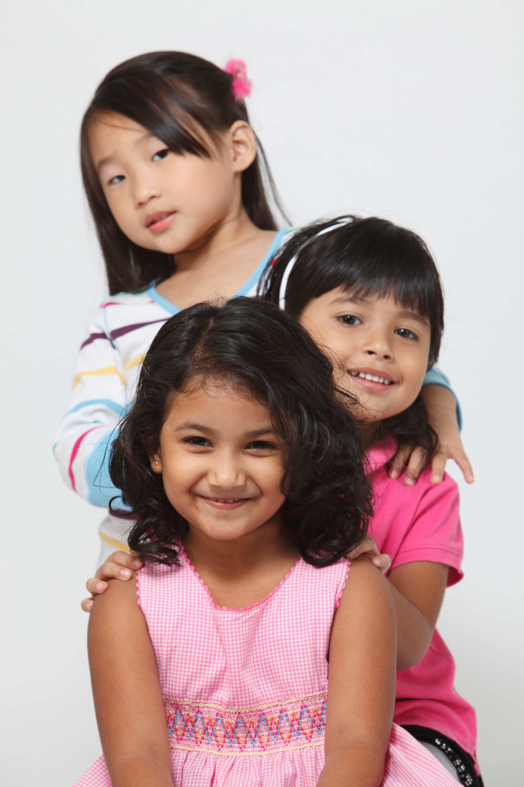 jpeg optimizer happy girls sitting against white background scaled