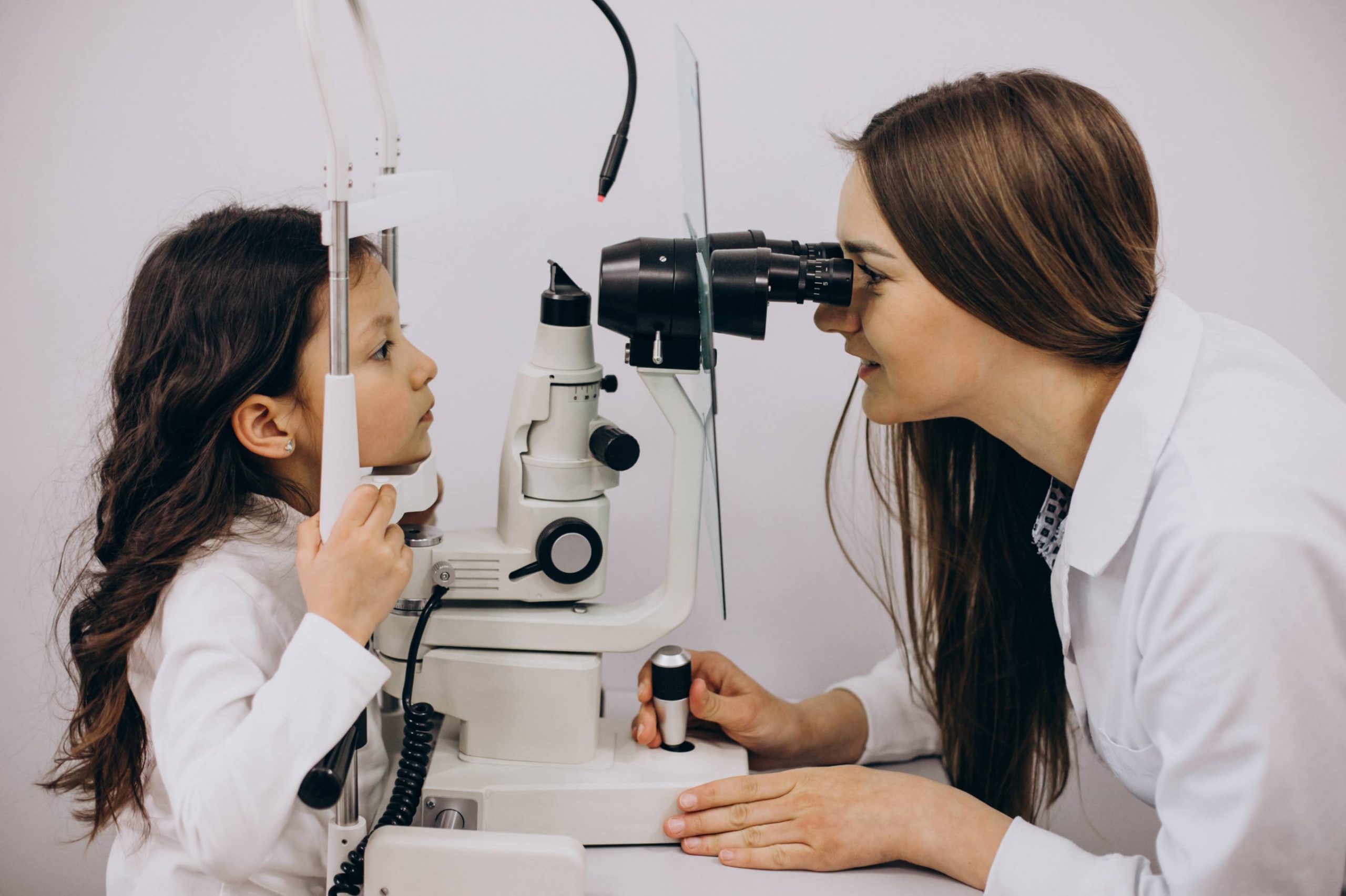 jpeg optimizer little girl checking up her sight ophthalmology center scaled